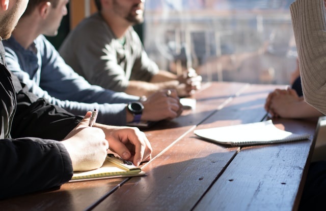 People in a meeting at a table